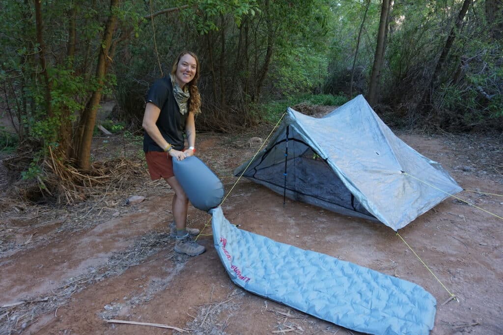 Woman wing up the Ether sea to summit sleeping pad
